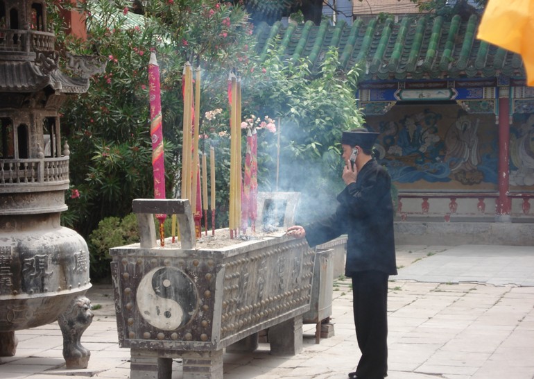 A monk on his mobile phone