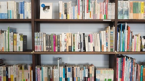 Bookshelves displaying many books and resources of Japanese literature
