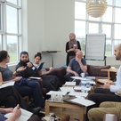 Group of people discussing in a classroom seminar setting