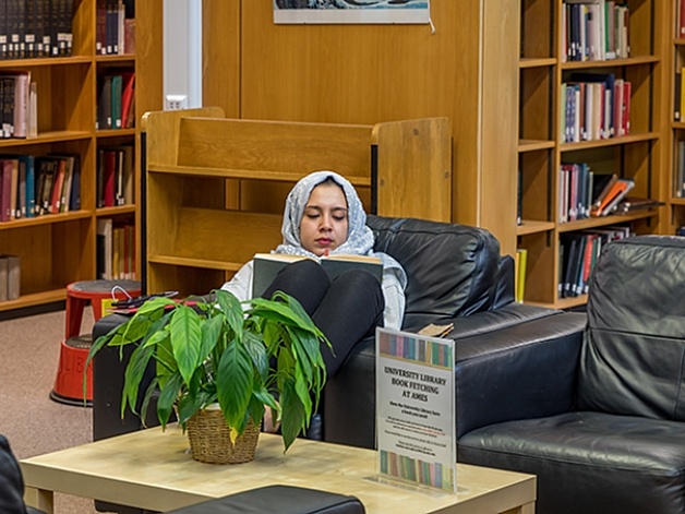 Person reading in the faculty library